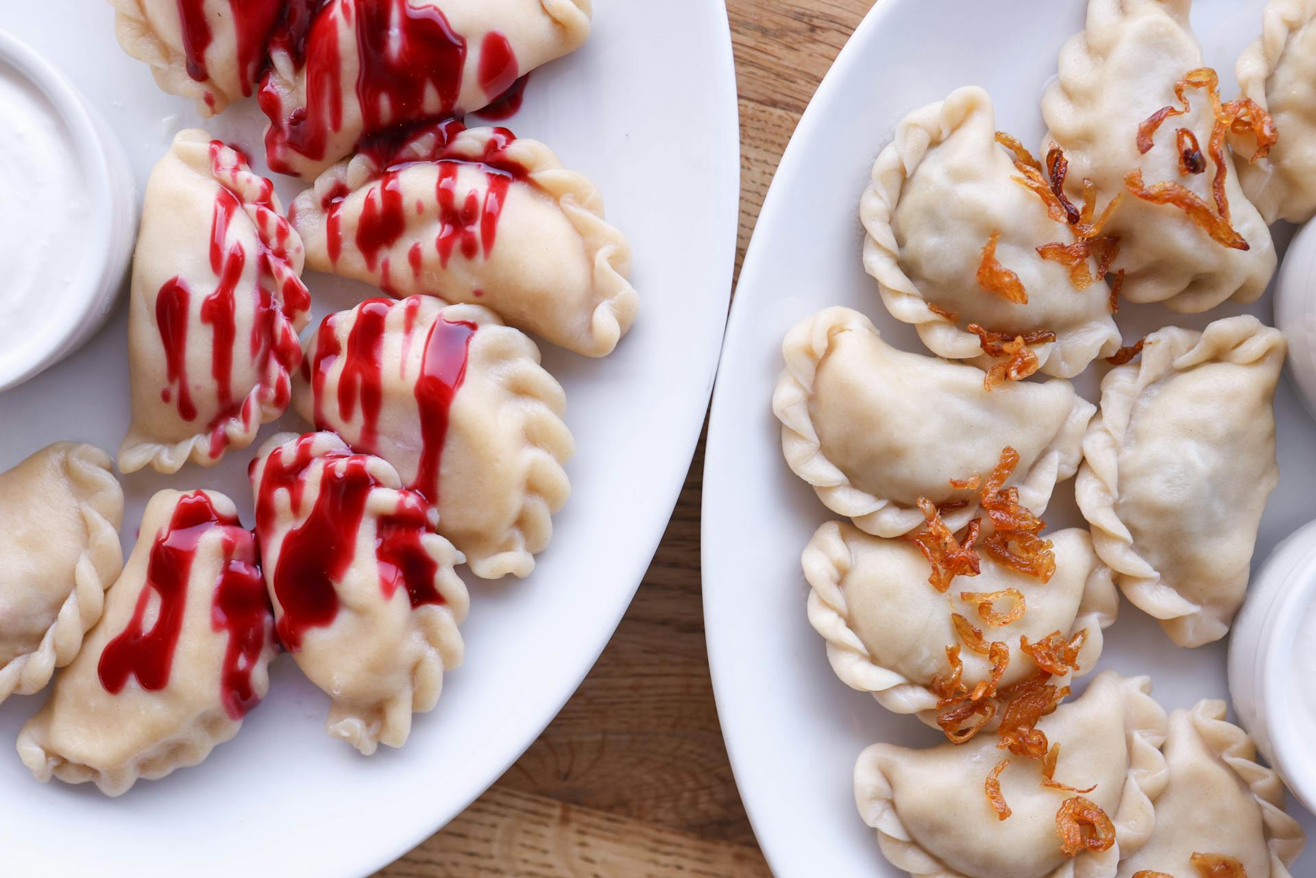 Two plates of pierogis