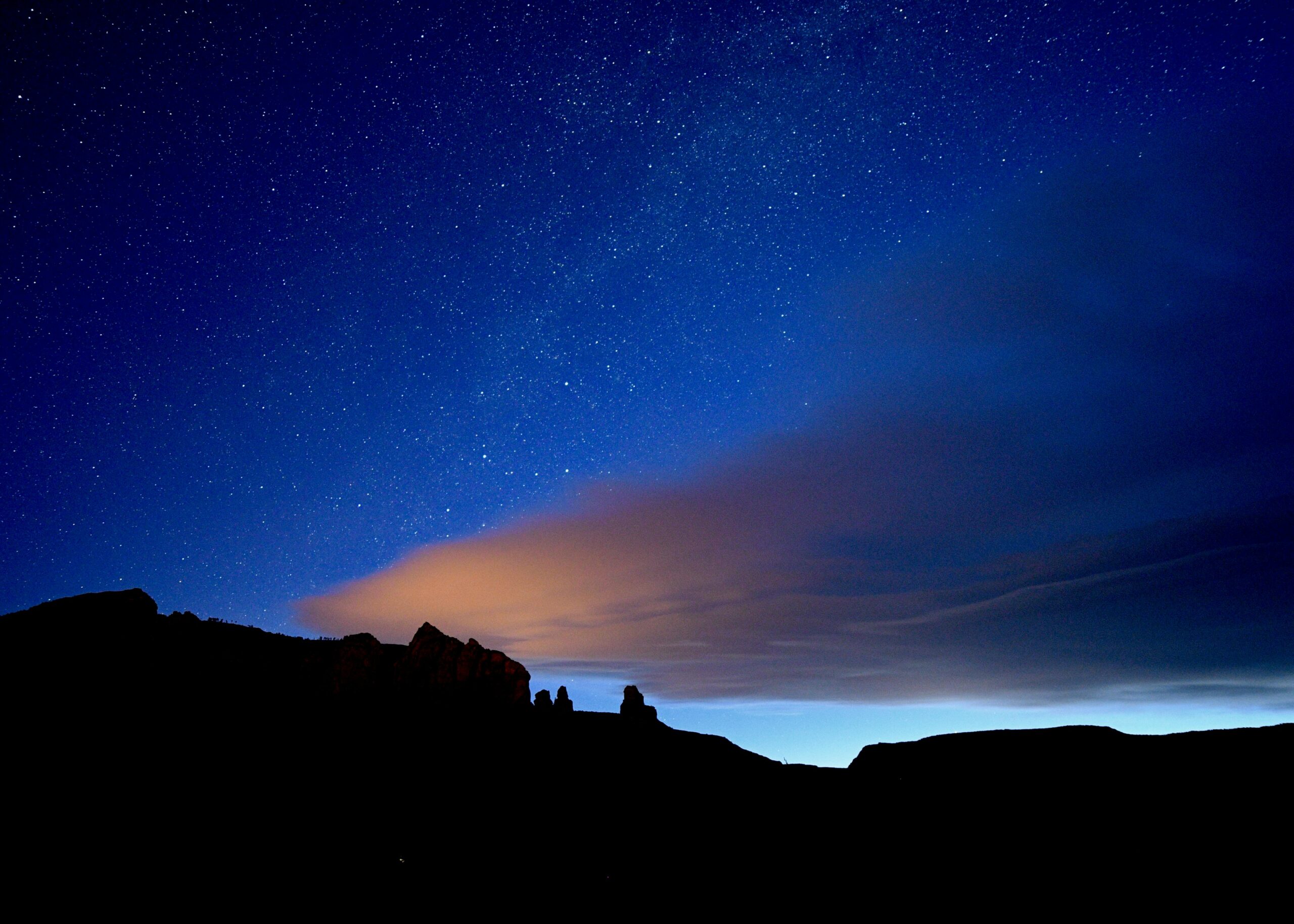 Night sky view in Sedona AZ with mountain silhouette