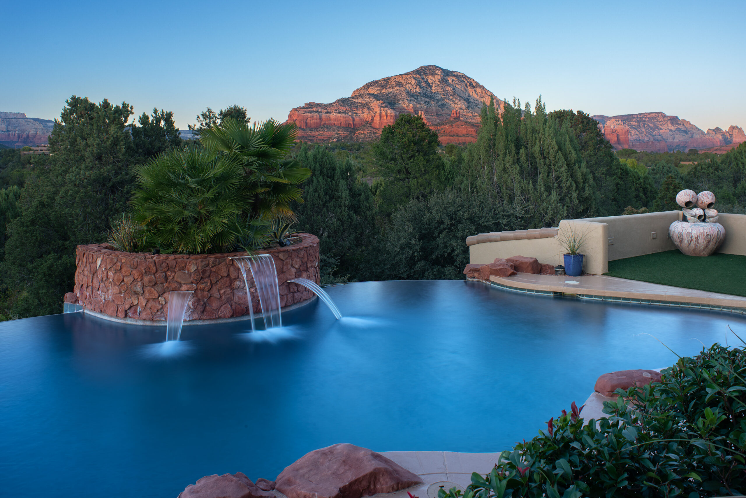 Infinity pool of a Sedona vacation rental with red rock views