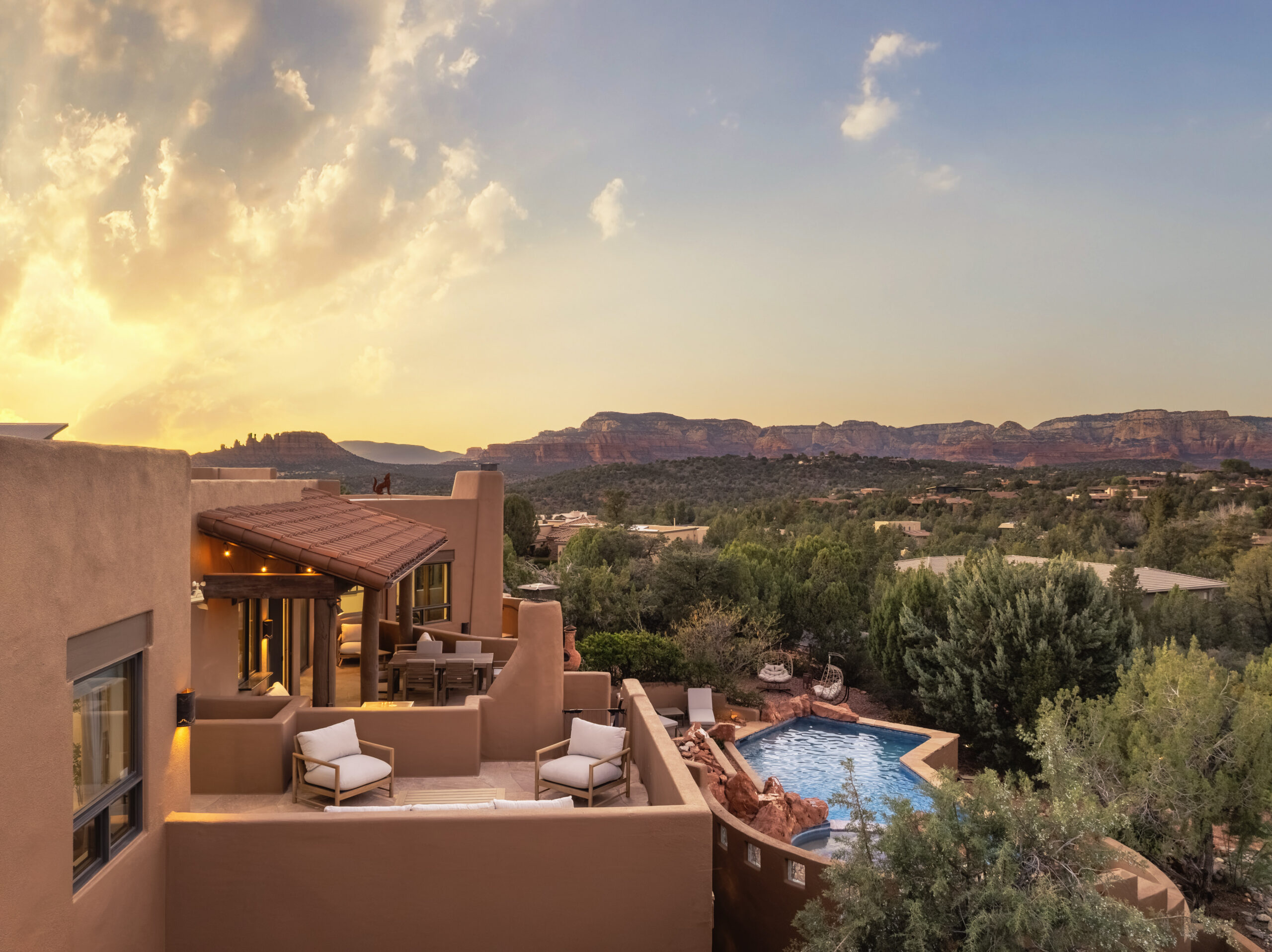 Bird's Eye View of a Sedona vacation rental's backyard with pool and Red rock views