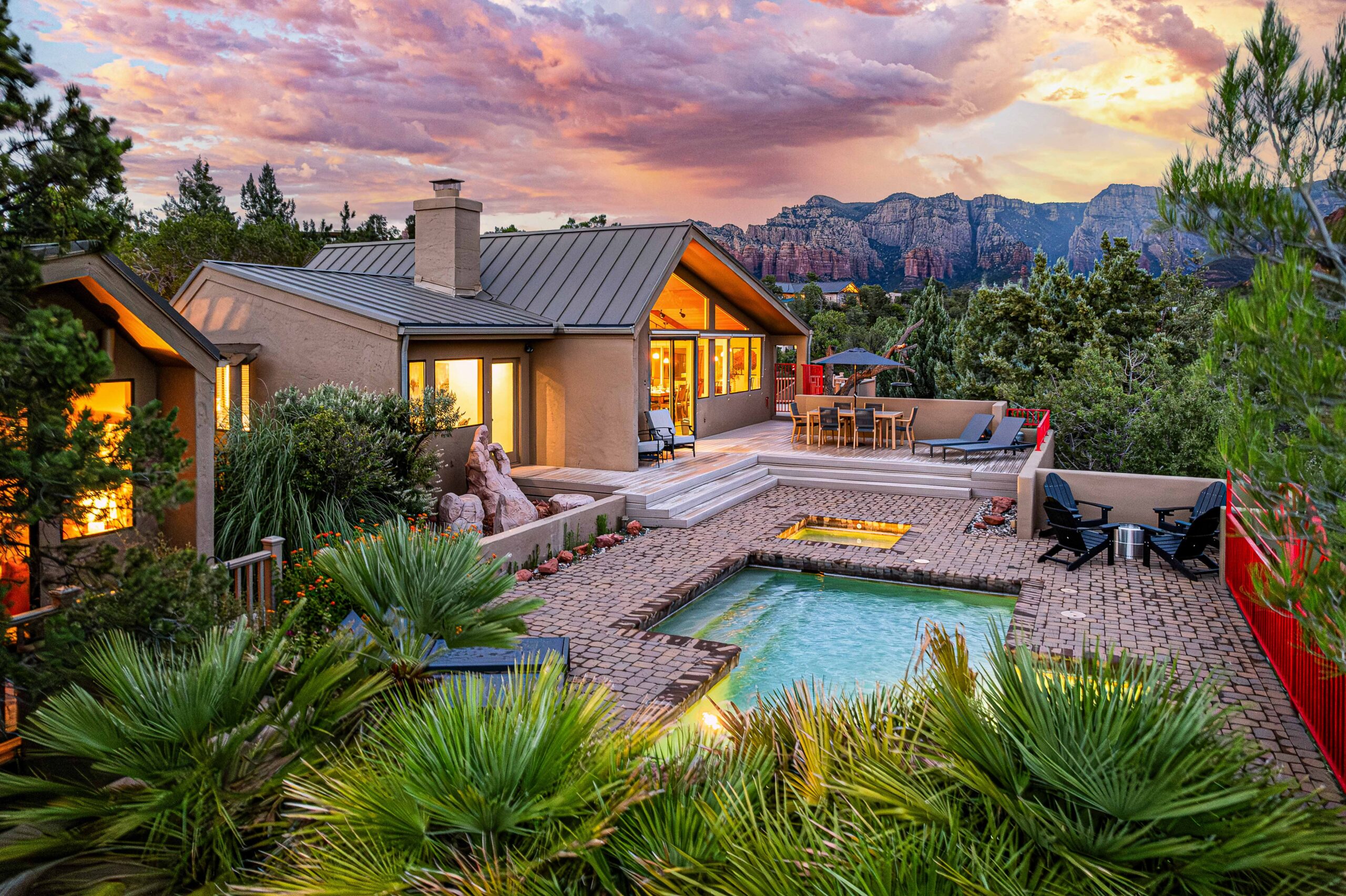 Sedona vacation rental backyard with pool and views of the red rocks.