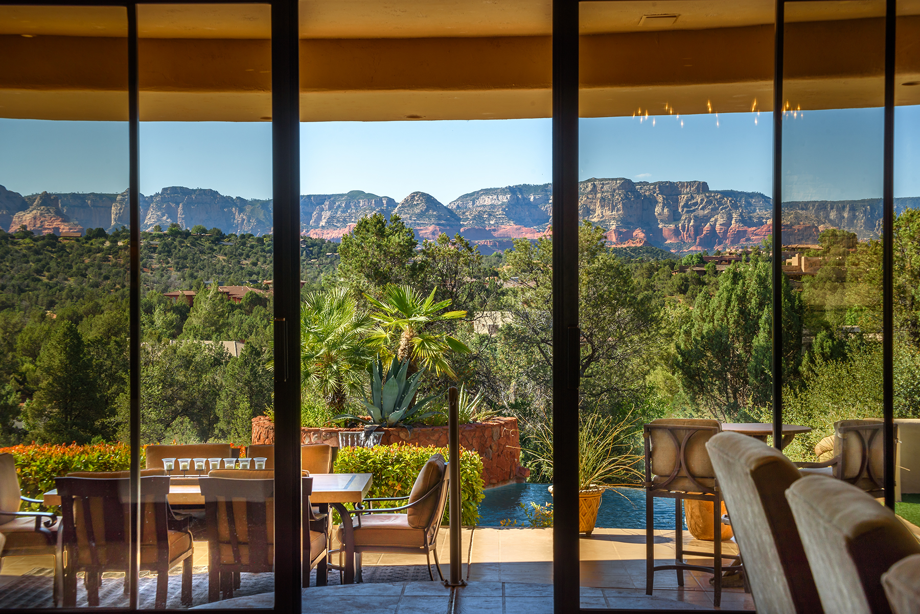 Sedona vacation rental with telescopic doors showcasing red rock views.