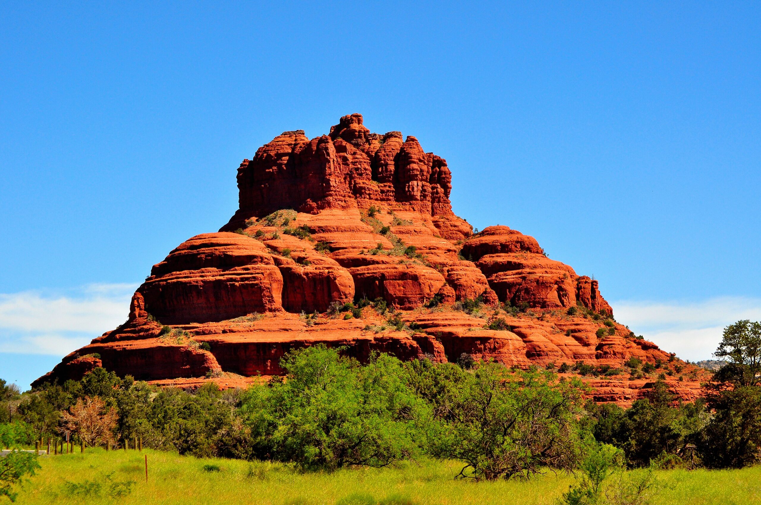 Bell Rock under a bright blue sky in Sedona, Arizona