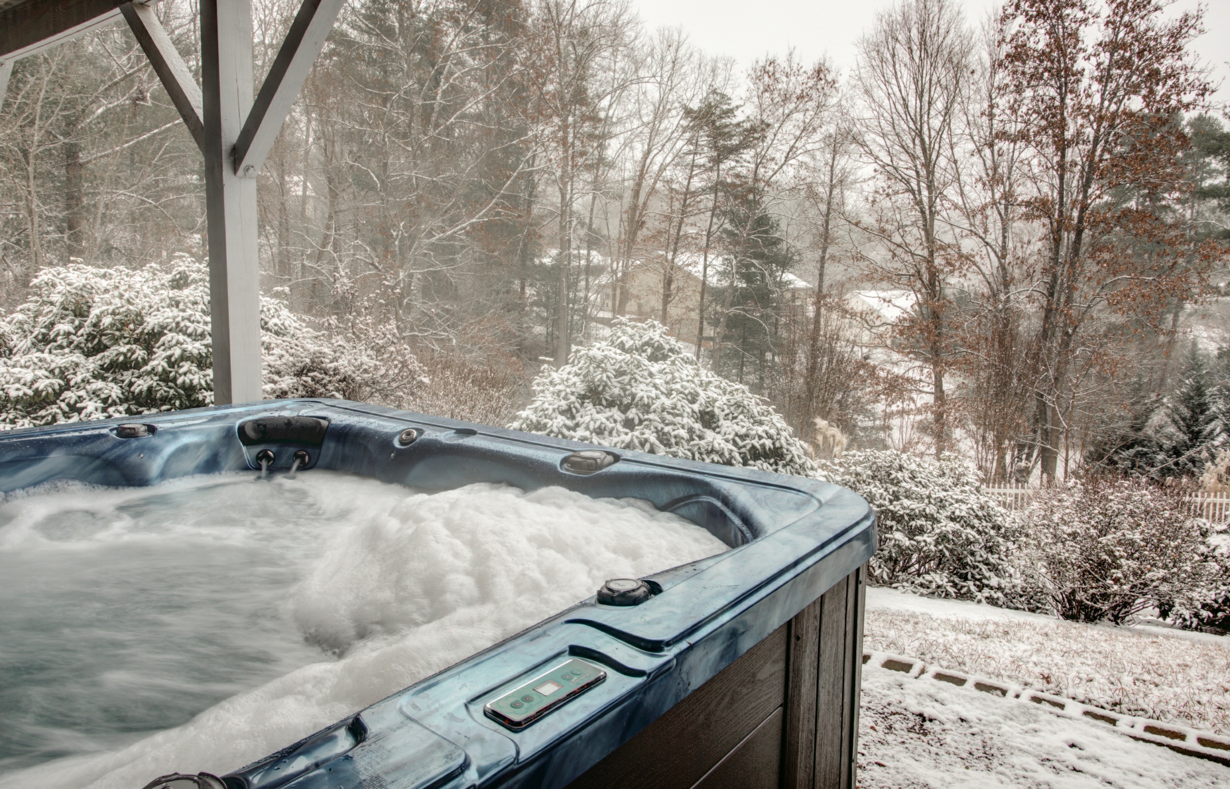 Asheville vacation rental hot tub running during winter.